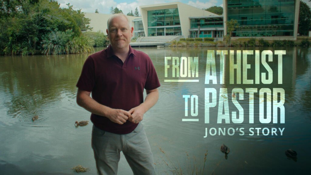 From Atheist to Pastor Jono's Story. A man stands in front of the University of Waikato in New Zealand.